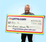 Winner Alam W. holds a check for $200,000 in his hands