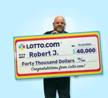 Winner Robert J. holds a check for $40,000 in his hands