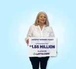 Winner Sonja B. holds a check for $1,550,000 in her hands